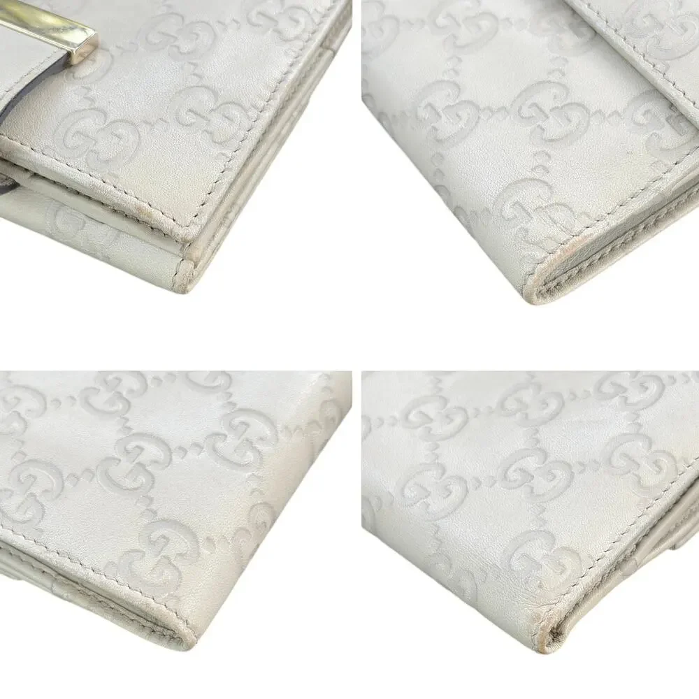 Gucci Guccissima Ivory Leather Compact Wallet with Gold Tab Snap Closure